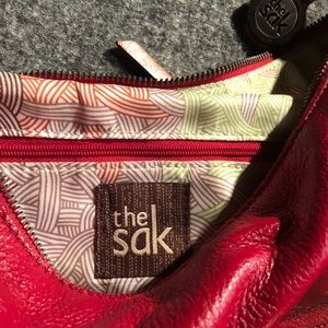 Genuine red & tan leather “The Sak” purse